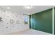 Bedroom with paw print wall decals and a green accent wall at 13148 Bliss Loop, Bradenton, FL 34211