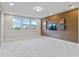 Bonus room with wood feature wall, TV space, and abundant natural light at 13148 Bliss Loop, Bradenton, FL 34211