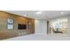 Bonus room with wood accent wall, media niche, and loft view at 13148 Bliss Loop, Bradenton, FL 34211