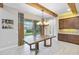 Elegant dining room with wooden table and access to the backyard at 13148 Bliss Loop, Bradenton, FL 34211