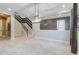 Spacious dining room with a modern chandelier and stairs at 13148 Bliss Loop, Bradenton, FL 34211
