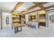 Gourmet kitchen boasts an island, stainless steel appliances, and wood beams at 13148 Bliss Loop, Bradenton, FL 34211