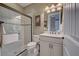 Clean bathroom with a glass shower and white vanity at 13421 Orino St, Venice, FL 34293