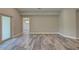 Spacious living room with tile floors and sliding glass doors at 158 Apollo Dr, Rotonda West, FL 33947