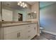 Bathroom features a double vanity, granite counters and wood-look tile flooring at 160 Apollo Dr, Rotonda West, FL 33947