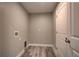 Utility room with tile floor and laundry hookups, ready for appliances at 160 Apollo Dr, Rotonda West, FL 33947