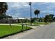 Street view of two homes with lush landscaping and palm trees at 1860 Southpointe Dr, Sarasota, FL 34231