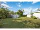 Large backyard with grassy area and storage shed at 2057 Garden Pkwy, Bradenton, FL 34205