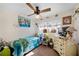 Cozy bedroom with a twin bed and plenty of natural light at 2057 Garden Pkwy, Bradenton, FL 34205