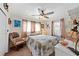 Quaint bedroom with rocking chair and eclectic decor at 2057 Garden Pkwy, Bradenton, FL 34205