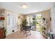 Bright breakfast nook with glass table and access to backyard at 2057 Garden Pkwy, Bradenton, FL 34205