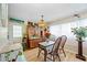 Charming dining area with vintage hutch and hardwood floors at 2057 Garden Pkwy, Bradenton, FL 34205