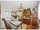 Quaint dining area with vintage wooden table and chairs near the kitchen at 2057 Garden Pkwy, Bradenton, FL 34205