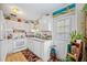 White kitchen features stainless steel appliances and ample cabinet space at 2057 Garden Pkwy, Bradenton, FL 34205
