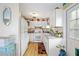 Cozy kitchen with white cabinets, granite countertops, and a modern stove at 2057 Garden Pkwy, Bradenton, FL 34205