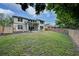 Spacious backyard with grassy area and home view at 228 36Th Ne St, Bradenton, FL 34208