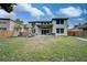 Large backyard with playground, patio, and grassy area at 228 36Th Ne St, Bradenton, FL 34208