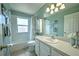 Clean bathroom with a bathtub, shower, and white vanity at 228 36Th Ne St, Bradenton, FL 34208