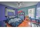 Bedroom with a queen bed, and wood floors at 228 36Th Ne St, Bradenton, FL 34208