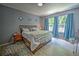 Spacious bedroom with large bed, wood furniture, and ample natural light at 228 36Th Ne St, Bradenton, FL 34208