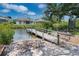 Wooden community dock providing access to the waterway at 228 36Th Ne St, Bradenton, FL 34208