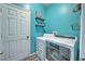 Laundry room with washer and dryer, and teal walls at 228 36Th Ne St, Bradenton, FL 34208