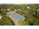 Tennis courts and basketball court surrounded by trees at 2425 Floyd St, Sarasota, FL 34239