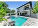 Stunning backyard with a refreshing pool, modern landscaping, and a view of the house at 2425 Floyd St, Sarasota, FL 34239