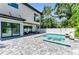 Modern backyard with a pool, patio, and an outdoor living area perfect for entertaining guests at 2425 Floyd St, Sarasota, FL 34239