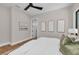 Comfortable bedroom featuring a ceiling fan, wood floors, and calming wall art at 2425 Floyd St, Sarasota, FL 34239