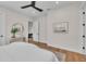 Light-filled bedroom with wood floors, ensuite access, and contemporary decor at 2425 Floyd St, Sarasota, FL 34239