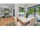 Open-concept dining area with a modern table and chairs, overlooking the pool at 2425 Floyd St, Sarasota, FL 34239