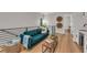 Upstairs living area featuring modern furniture, wood floors and a kitchenette at 2425 Floyd St, Sarasota, FL 34239