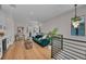 Bright open-concept living space with modern railing and lots of natural light at 2425 Floyd St, Sarasota, FL 34239