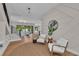 Open-concept living area featuring hardwood floors, white walls, modern lighting, and staircase access at 2425 Floyd St, Sarasota, FL 34239