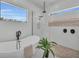 Main bath features a free-standing tub and rain shower at 2425 Floyd St, Sarasota, FL 34239