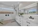 Main bath has dual vanities, modern fixtures and large shower at 2425 Floyd St, Sarasota, FL 34239