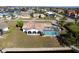 Bird's-eye view showcasing home, pool, and canal-side location at 2711 W Marion Ave, Punta Gorda, FL 33950