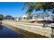 Home's back features a screened pool and canal access at 2711 W Marion Ave, Punta Gorda, FL 33950