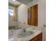Small bathroom with a vanity and wood-trimmed medicine cabinet at 2711 W Marion Ave, Punta Gorda, FL 33950