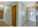 Light-green-walled entryway with wood door and tiled floor at 2711 W Marion Ave, Punta Gorda, FL 33950