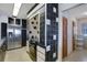 A kitchen with black and white tile, stainless steel appliances and built in oven at 2711 W Marion Ave, Punta Gorda, FL 33950