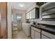 Laundry room with washer, dryer, sink, and exterior access at 2711 W Marion Ave, Punta Gorda, FL 33950