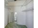 Large walk-in closet with wire shelving and mirrored doors at 2711 W Marion Ave, Punta Gorda, FL 33950