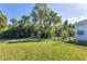 Large backyard with fenced area and lush greenery at 4010 91St E Ave, Parrish, FL 34219