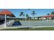 Community shuffleboard court with covered seating at 4206 Chinaberry Rd, Bradenton, FL 34208