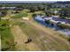 Aerial view of golf course with a golf cart at 4460 Fairways Blvd # 306, Bradenton, FL 34209