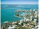 Aerial view of waterfront community with marina, high-rise buildings, and boats at 4460 Fairways Blvd # 306, Bradenton, FL 34209