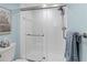 Updated walk-in shower with clean white tile and glass enclosure at 4460 Fairways Blvd # 306, Bradenton, FL 34209