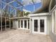 Back patio with access to the house and screened enclosure at 4865 Featherbed Ln, Sarasota, FL 34242